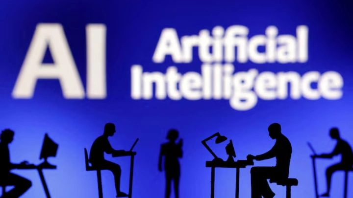 Figurines with computers and smartphones are seen in front of the words "Artificial Intelligence AI" in this illustration taken, February 19, 2024. REUTERS/Dado Ruvic/Illustration/File Photo