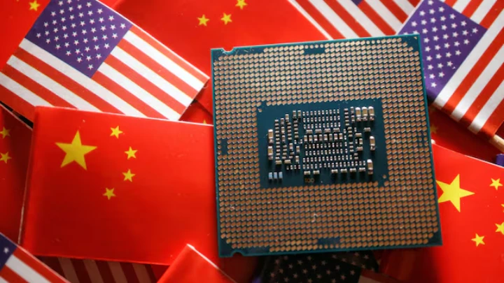 A central processing unit (CPU) semiconductor chip is displayed among flags of China and U.S., in this illustration picture taken February 17, 2023. REUTERS/Florence Lo/Illustration/File Photo 