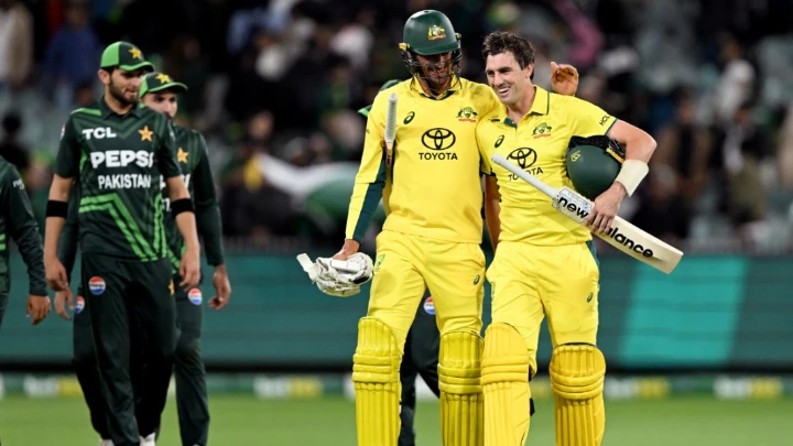 Australian batsman Pat Cummins (R) is congratulated by teammate Mitchell Starc after hitting the winning run during the first ODI against Pakistan at the Melbourne Cricket Ground (MCG) in Melbourne on November 4, 2024. Photo: AFP