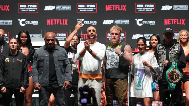  Nov 13, 2024; Irving, TX, USA; Jake Paul (right) faces off with Mike Tyson (left) during a press conference at The Pavilion at Toyota Music Factory. Mandatory Credit: Kevin Jairaj-Imagn Images