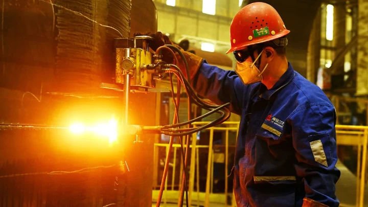 A worker builds petrochemical equipment parts at Lanshi Heavy Machinery in Qingdao, China, on October 31, 2024. Costfoto/NurPhoto/Getty Images/File