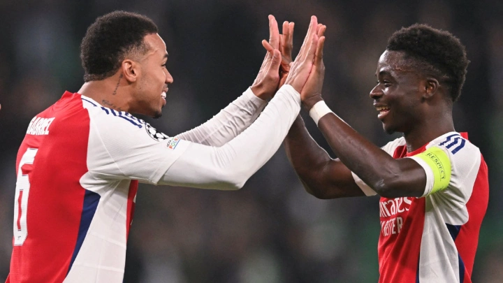 Arsenal's Gabriel Magalhaes celebrates with Bukayo Saka after their UEFA Champions League, league phase day 5 match against Sporting CP at the Jose Alvalade stadium in Lisbon, on November 26, 2024. PHOTO: AFP