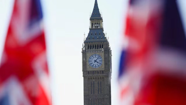 Union Jack flags flutter in the wind near Big Ben at Parliament Square in London, Britain, August 27, 2024. REUTERS/Mina Kim/File Photo