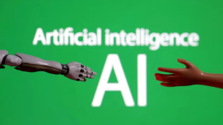 Words reading "Artificial intelligence AI", miniature of robot and toy hand are pictured in this illustration taken December 14, 2023. REUTERS/Dado Ruvic/Illustration/File Photo