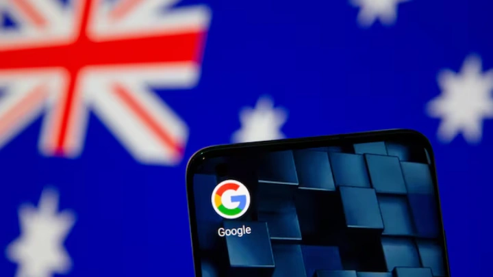 Smartphone with google app icon is seen in front of the displayed Australian flag in this illustration taken, January 22, 2021. REUTERS/Dado Ruvic/Illustration/File Photo