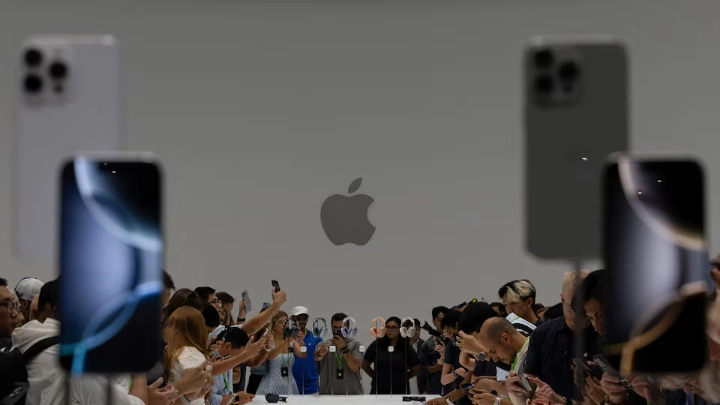 Attendees test the iPhone 16 Pro as Apple holds an event at the Steve Jobs Theater on its campus in Cupertino, California, U.S. September 9, 2024. REUTERS/Manuel Orbegozo/File Photo