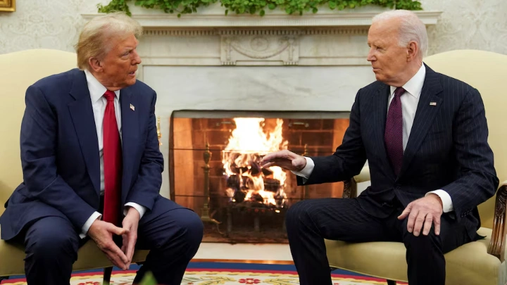 U.S. President Joe Biden meets with President-elect Donald Trump in the Oval Office at the White House in Washington, U.S., November 13, 2024. REUTERS/Kevin Lamarque/File Photo