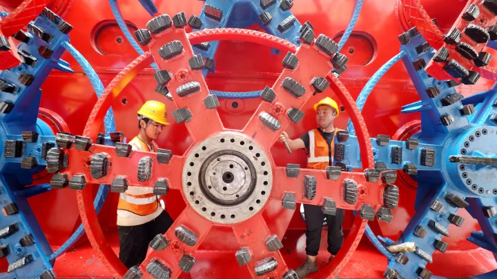 China Railway workers assemble a pipe jacking machine at the construction site of an underground railway station, in Huzhou, Zhejiang province, China October 17, 2024. China Daily via REUTERS