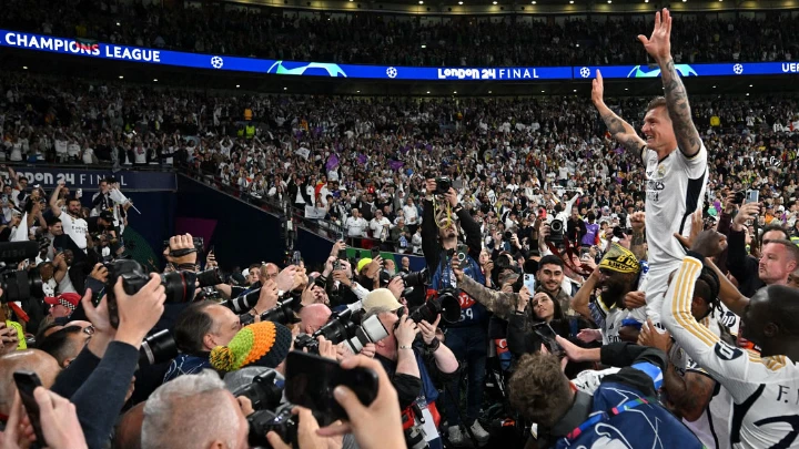 Real Madrid's German midfielder Toni Kroos, who entered the history books by winning his sixth Champions League on Saturday, celebrates with supporters after winning UEFA Champions League final against Borussia Dortmund at the Wembley Stadium, in London, on June 1, 2024. PHOTO: AFP