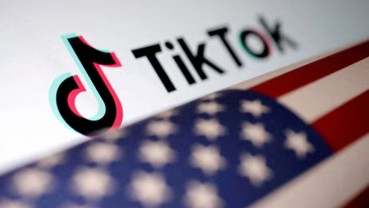 U.S. flag is placed on a TikTok logo in this illustration taken March 20, 2024. REUTERS/Dado Ruvic/Illustration/File Photo 