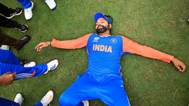 India's captain Rohit Sharma lays on the ground as he celebrates with Team India after winning ICC men's Twenty20 World Cup 2024 final cricket match between India and South Africa at Kensington Oval in Bridgetown, Barbados, on June 29, 2024. Photo : AFP