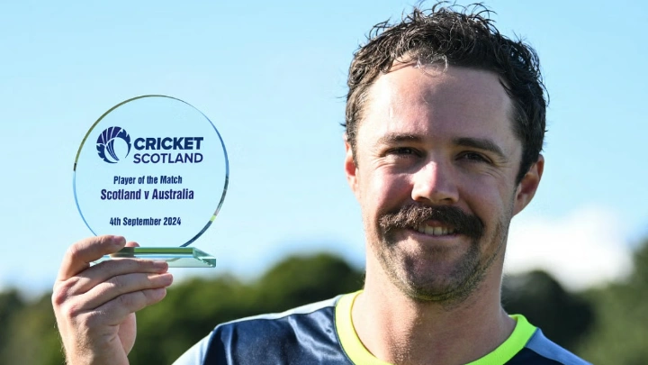 Australia's Travis Head celebrates with the players of the match trophy at the end of the first Twenty20 International cricket match between Scotland and Australia at the Grange Cricket Club in Edinburgh, Scotland, on September 4, 2024. Australia wins against Scotland. Photo: AFP