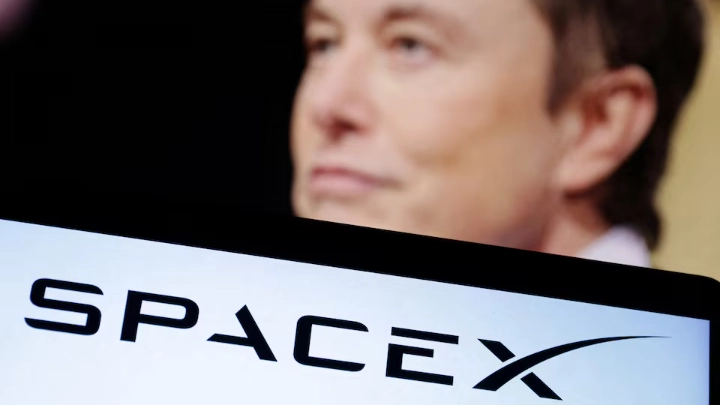 SpaceX logo and Elon Musk photo are seen in this illustration taken, December 19, 2022. REUTERS/Dado Ruvic/Illustration/File Photo