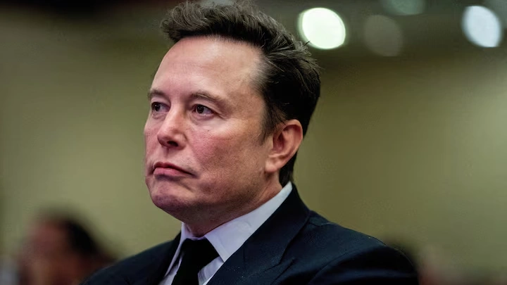 Tesla CEO and X owner Elon Musk listens as US President-elect Donald Trump speaks during a meeting with House Republicans at the Hyatt Regency hotel in Washington, DC, U.S. on November 13, 2024. ALLISON ROBBERT/Pool via REUTERS/File Photo